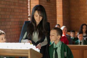 St Francis Xavier Catholic Primary School Ashbury - Parent and student lighting candles